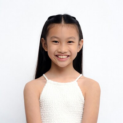 Asian girl smiling in white dress
