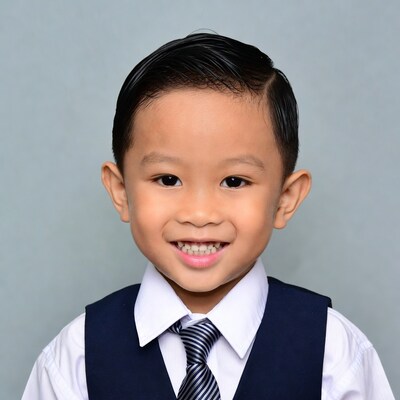 Asian boy smiling in suit