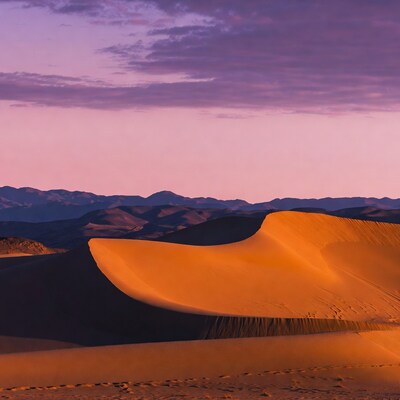 Sand Dunes at Sunset with Mountains