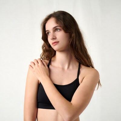 Young woman in black sports bra