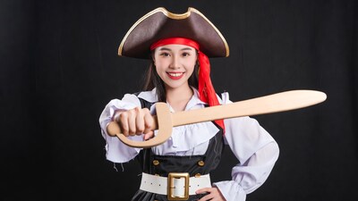 Asian woman in pirate costume with sword