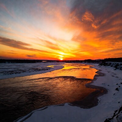 Sunset over frozen river