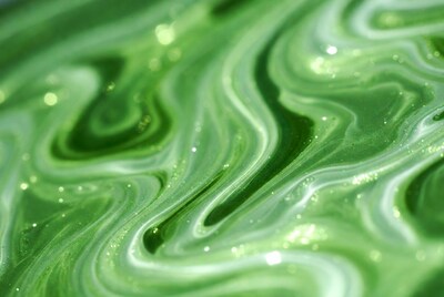 Green glittery fluid art abstract