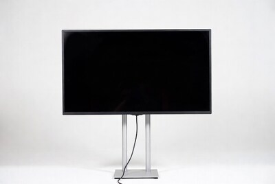 Black monitor on silver stand