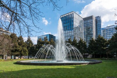 Fountain in park with skyscrapers