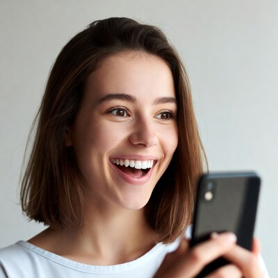 Smiling woman holding smartphone