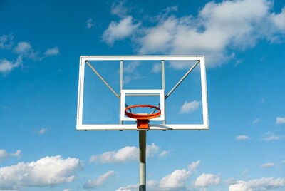 Basketball hoop against blue sky