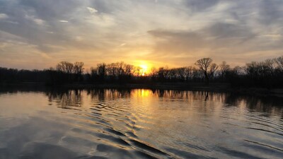 Sunset over lake with trees