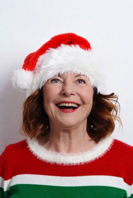 Smiling woman in Santa hat