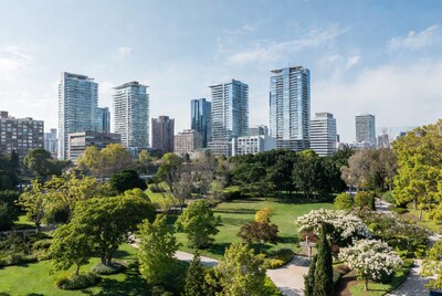 City skyline over lush green park