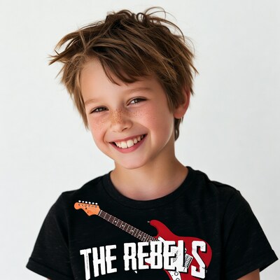 Boy smiling in Rebels guitar t-shirt
