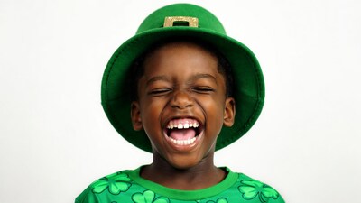 African-American boy laughing in leprechaun hat