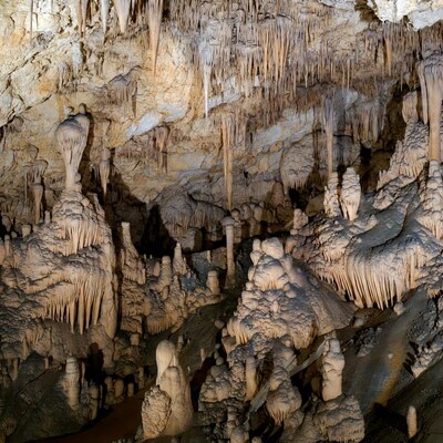 Stalactites in illuminated cave