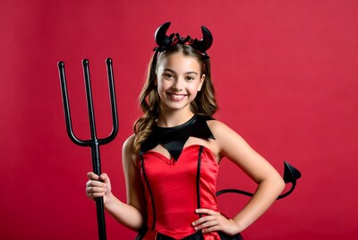 Girl in devil costume with pitchfork