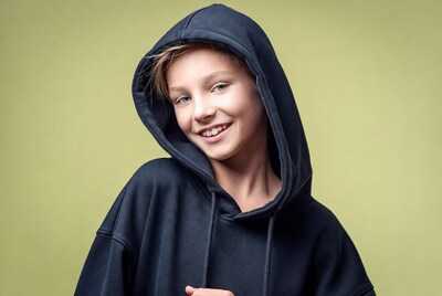 Boy smiling in navy hoodie