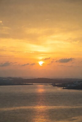 Sunset over lake with hills