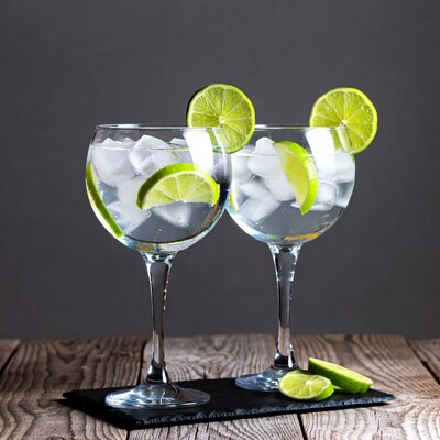 Two Gin Tonic Glasses with Limes