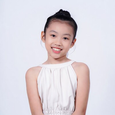 Asian girl smiling in white dress