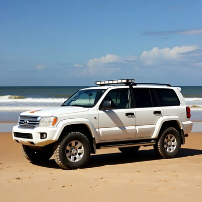 White Toyota Land Cruiser on beach