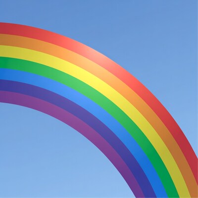 Rainbow arc on blue sky
