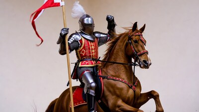 Knight in armor riding horse with flag