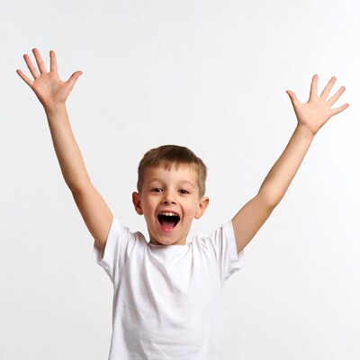Boy raising arms smiling