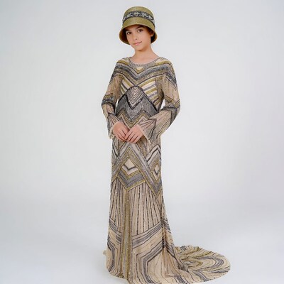 Girl in beaded flapper dress and hat