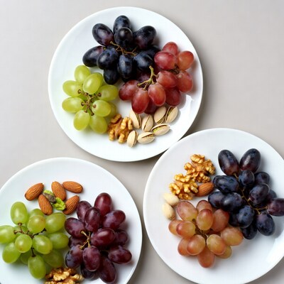 Assortment of Grapes and Nuts on Plates