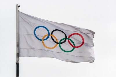 Olympic Rings Flag Waving on Pole