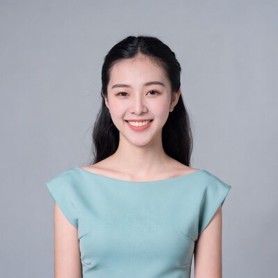 Asian woman smiling in teal dress