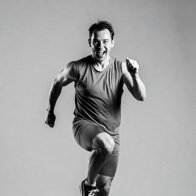 Muscular man running in tank top