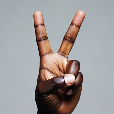 Black hand making peace sign
