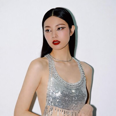 Asian woman in silver sequin dress
