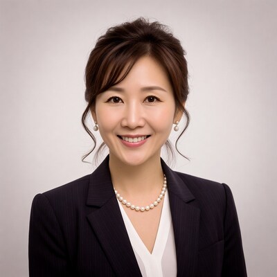 Asian woman in suit smiling