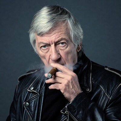 Elderly man smoking cigar in leather jacket