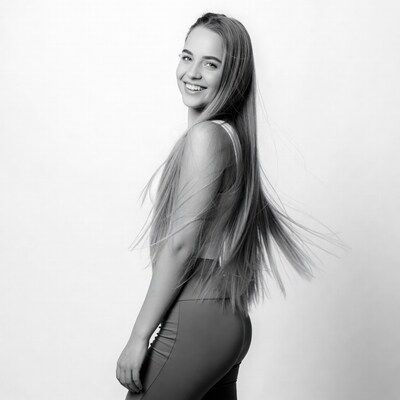 Smiling young woman in tank top leggings