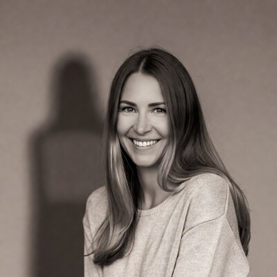 Smiling woman with long hair and shadow