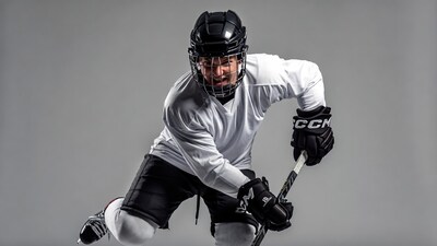Hockey player holding stick in action pose