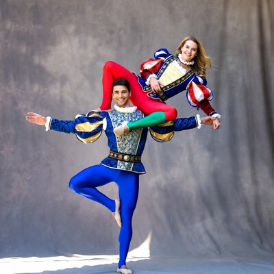 Man balancing woman in Renaissance acrobatic pose