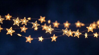 Glowing star fairy lights on dark background