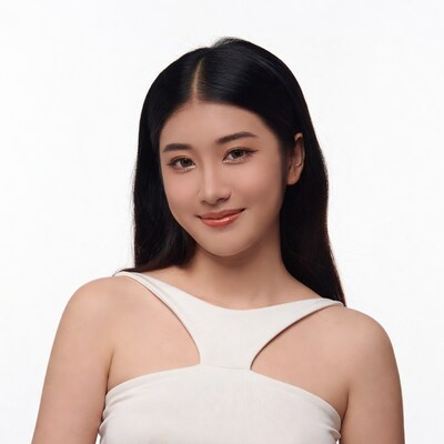 Asian woman smiling in white top