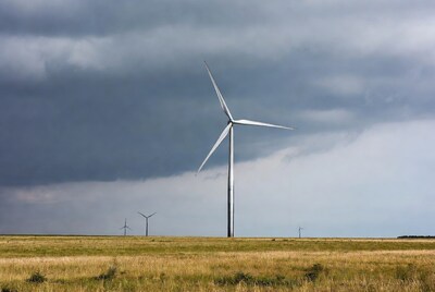Wind Turbines in Grassy Field