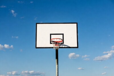 Basketball hoop on blue sky