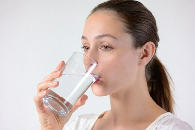 Woman drinking water from glass