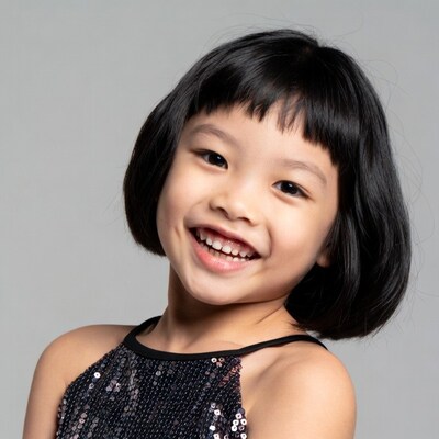 Asian girl smiling in sequin dress