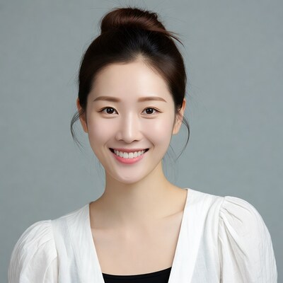 Smiling Asian woman in white blouse