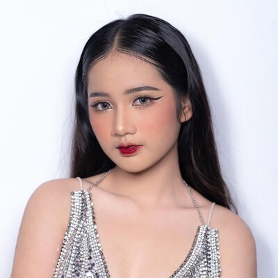 Asian woman in silver sequin dress