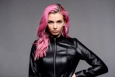 Woman with pink hair in leather jacket