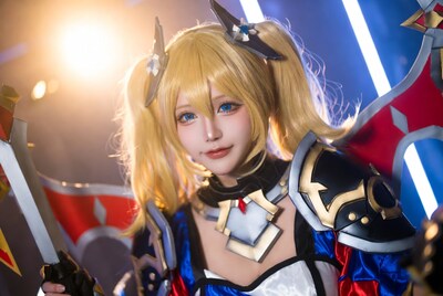 Blonde woman in blue armor cosplay