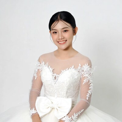 Asian woman in white lace wedding dress
